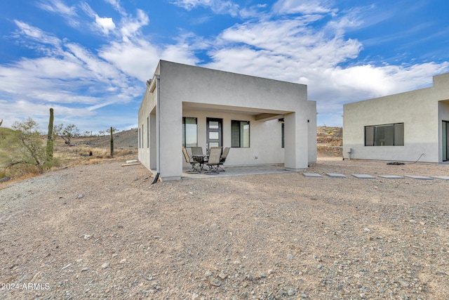 rear view of property with a patio