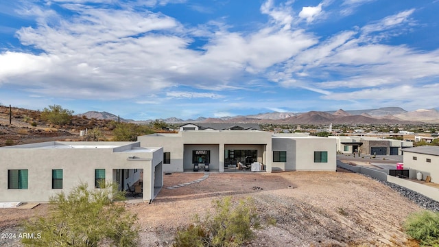 rear view of property with a mountain view