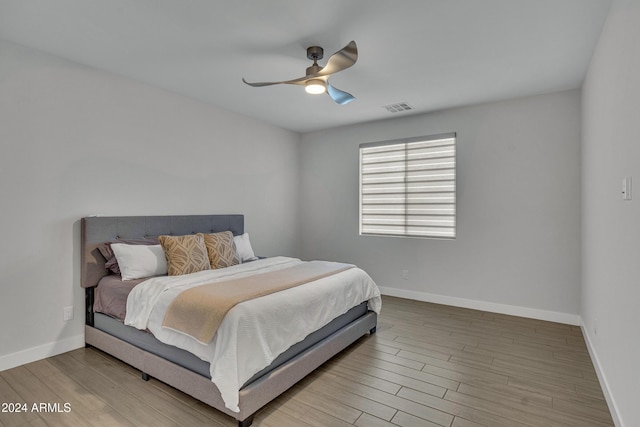 bedroom featuring hardwood / wood-style flooring and ceiling fan