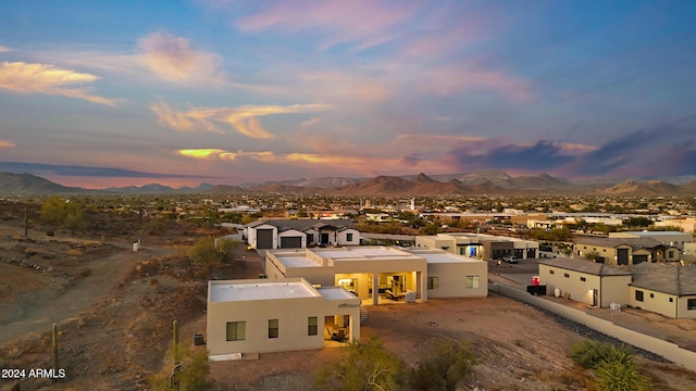 aerial view at dusk with a mountain view