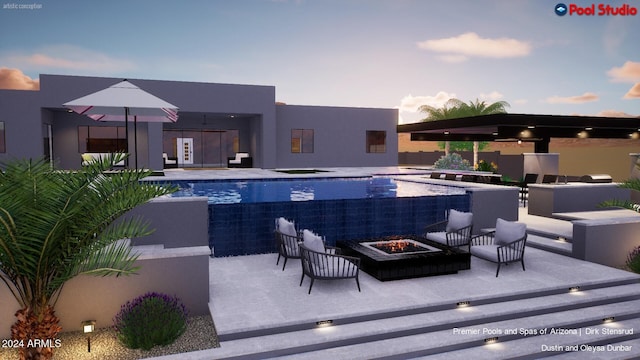 pool at dusk with a patio area and an outdoor fire pit