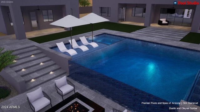 view of swimming pool with a patio