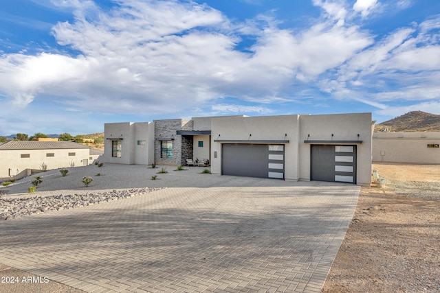 southwest-style home with a garage