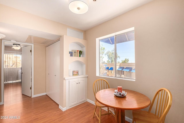 12221 W Bell Rd Unit 362, Surprise, AZ 85378 - dining room featuring baseboards, attic access, and light wood-style flooring