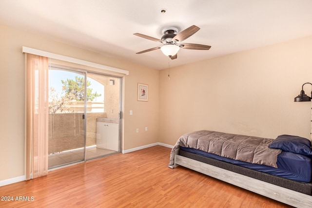 12221 W Bell Rd Unit 362, Surprise, AZ 85378 - bedroom with baseboards, a ceiling fan, wood finished floors, and access to exterior