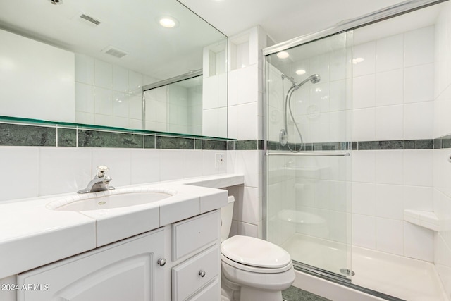 12221 W Bell Rd Unit 362, Surprise, AZ 85378 - bathroom with visible vents, a shower stall, toilet, and tile walls