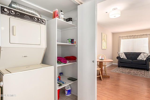 12221 W Bell Rd Unit 362, Surprise, AZ 85378 - washroom with stacked washer / dryer and wood finished floors