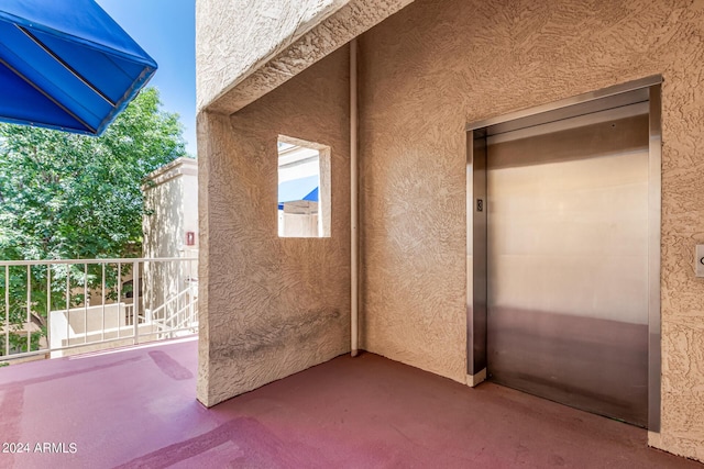 12221 W Bell Rd Unit 362, Surprise, AZ 85378 - exterior space with stucco siding and elevator