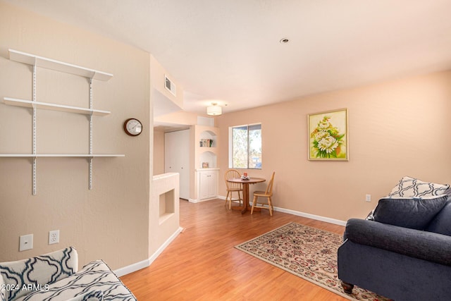 12221 W Bell Rd Unit 362, Surprise, AZ 85378 - living room with visible vents, baseboards, and wood finished floors