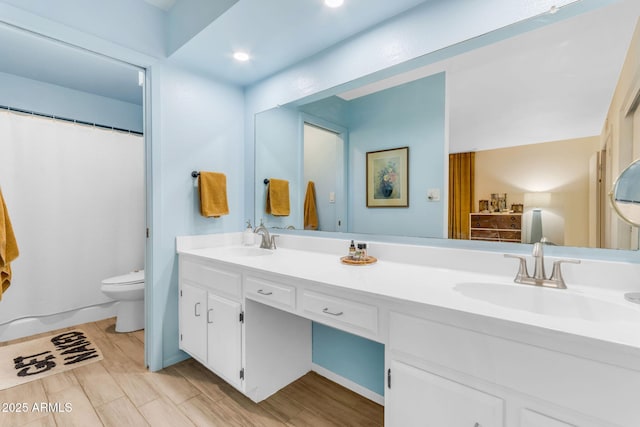 bathroom with vanity and toilet