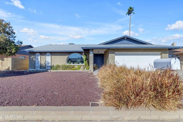 ranch-style house featuring a garage