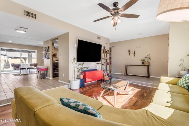 living room with hardwood / wood-style flooring and ceiling fan