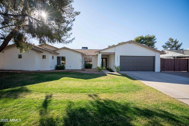 single story home featuring concrete driveway, a front lawn, an attached garage, and stucco siding