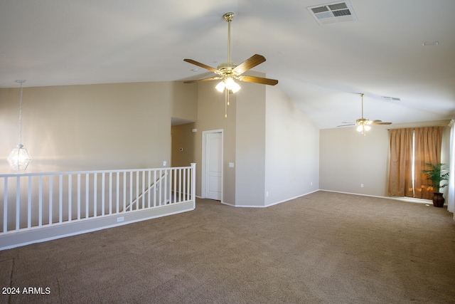 carpeted empty room featuring high vaulted ceiling and ceiling fan