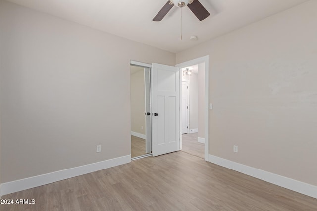 unfurnished bedroom with light hardwood / wood-style flooring and ceiling fan