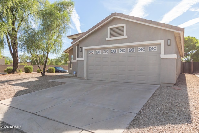 view of side of home with a garage