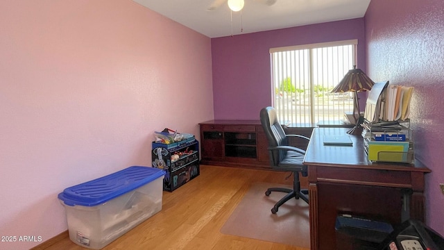 office featuring wood finished floors and a ceiling fan