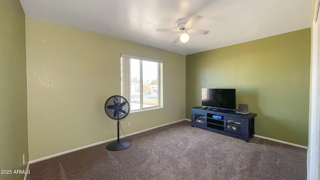 interior space with a ceiling fan, carpet flooring, and baseboards