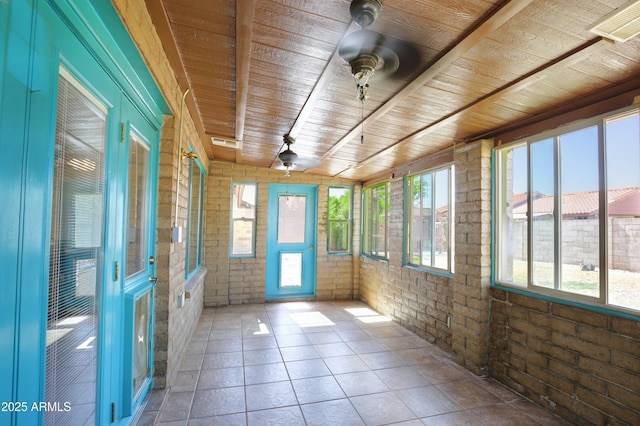 unfurnished sunroom with wooden ceiling, visible vents, and a ceiling fan