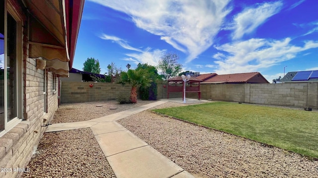 view of yard with a patio area and a fenced backyard