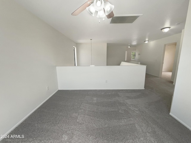 unfurnished room featuring visible vents, baseboards, carpet, and ceiling fan