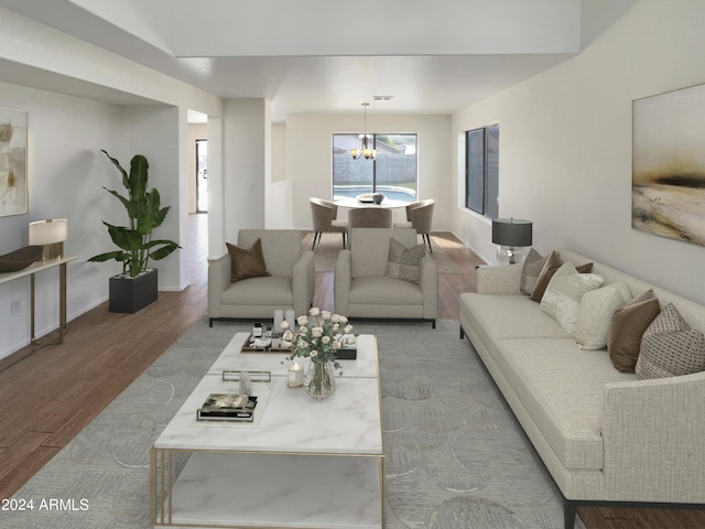 living area featuring an inviting chandelier, baseboards, and wood finished floors