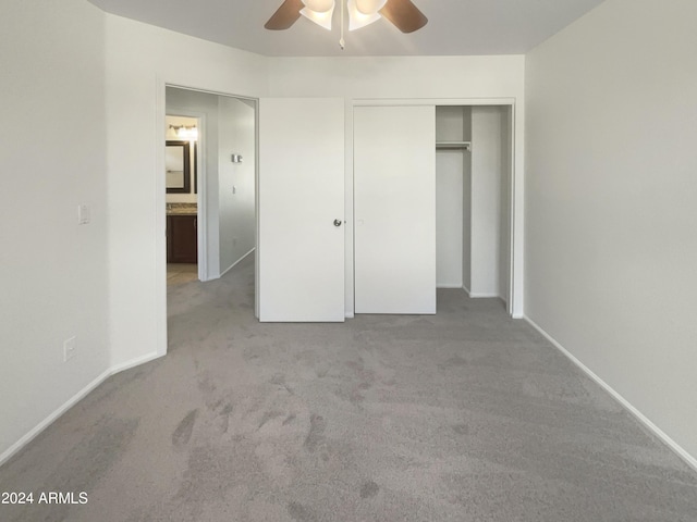 unfurnished bedroom with a closet, a ceiling fan, baseboards, and carpet floors