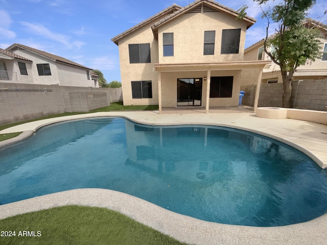 view of pool with a fenced in pool, a fenced backyard, and a patio area