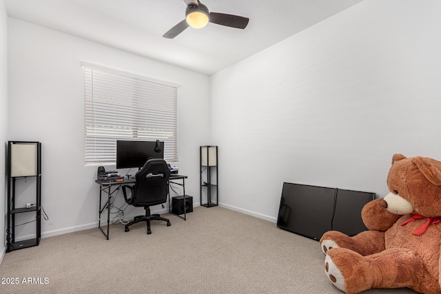 office area featuring carpet flooring, a ceiling fan, and baseboards