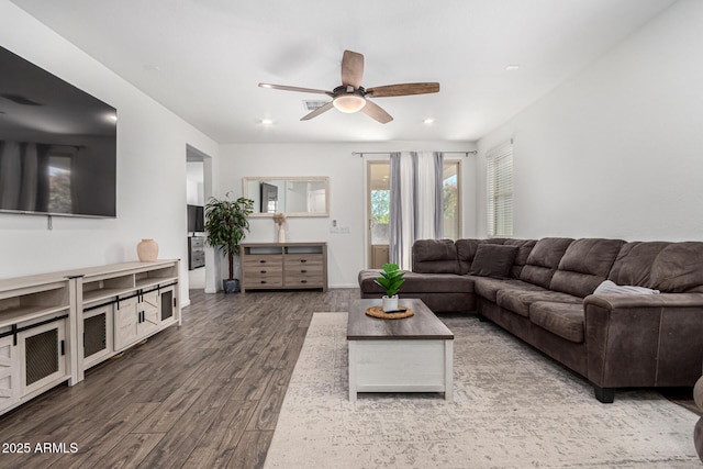 living room featuring a ceiling fan, recessed lighting, and wood finished floors