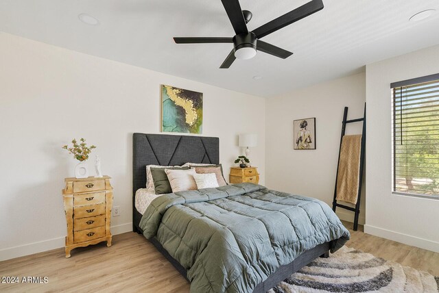 bedroom featuring ceiling fan and light wood-type flooring