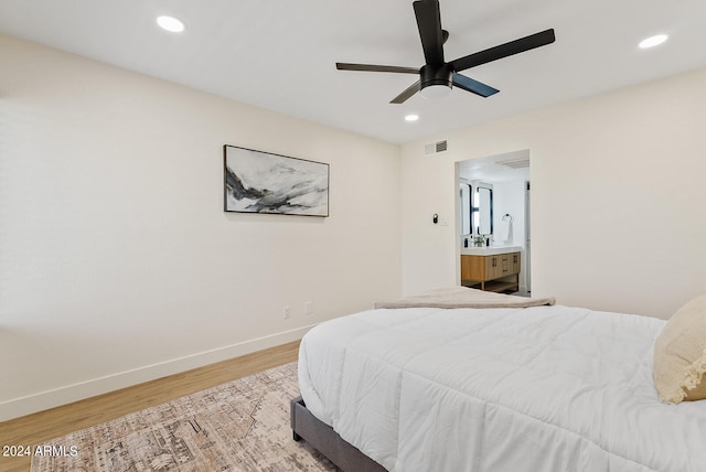 bedroom featuring ceiling fan and light hardwood / wood-style floors