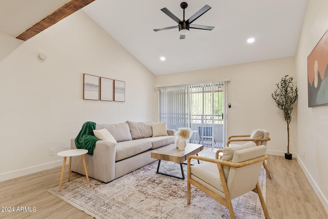 living room featuring ceiling fan, light wood-type flooring, and high vaulted ceiling