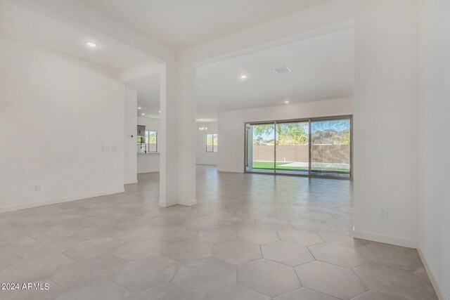 spare room with light tile patterned floors