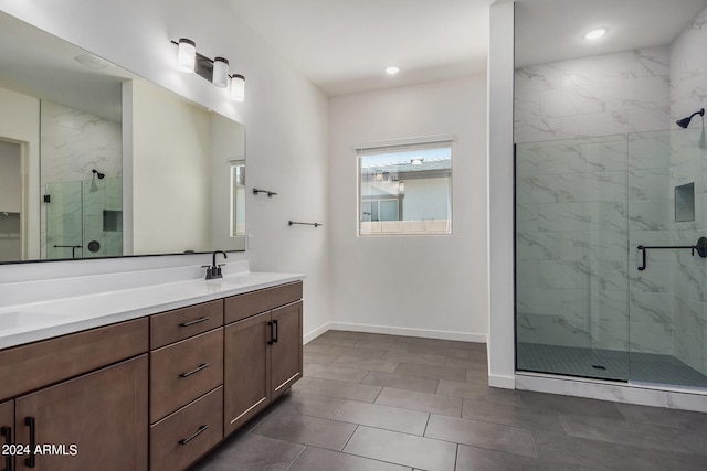 bathroom featuring vanity, tile patterned floors, and walk in shower