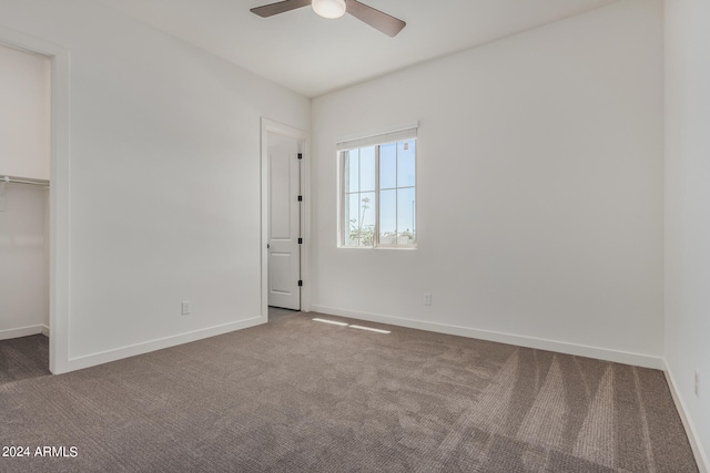 spare room with carpet floors and ceiling fan