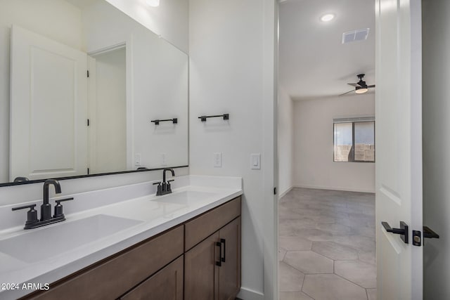 bathroom featuring vanity, ceiling fan, and tile patterned flooring