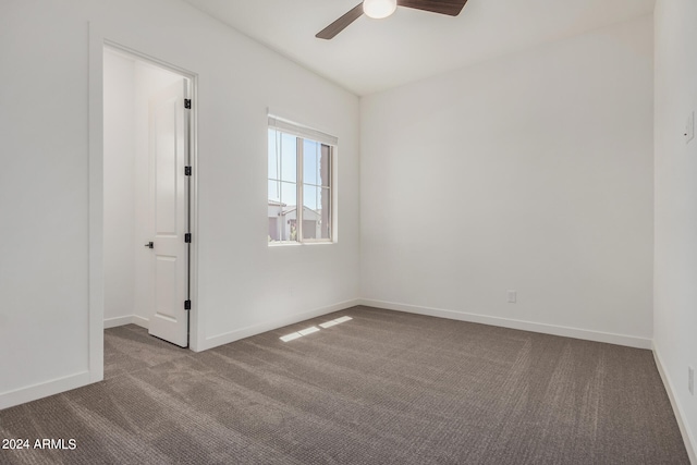 spare room with carpet flooring and ceiling fan