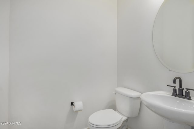 bathroom with sink and toilet