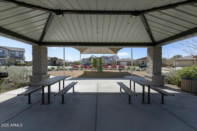 view of property's community with a gazebo and a patio area
