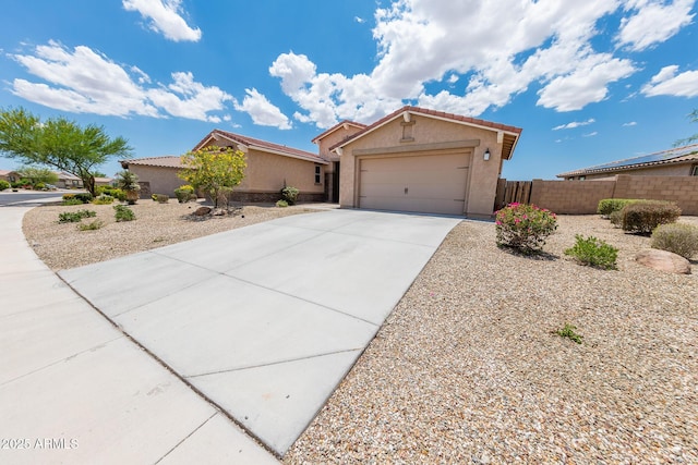 15248 S 182nd Ln, Goodyear, AZ 85338 - ranch-style home featuring stucco siding, concrete driveway, an attached garage, and a tiled roof
