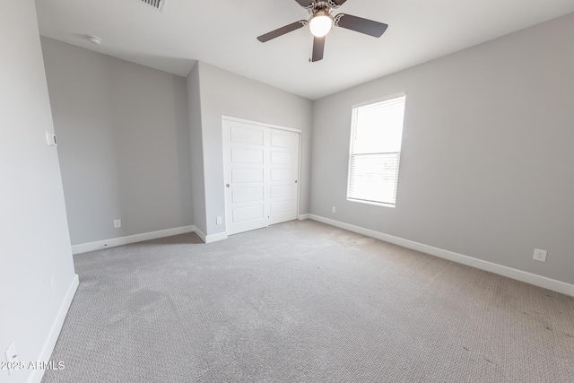 15248 S 182nd Ln, Goodyear, AZ 85338 - unfurnished bedroom with baseboards, carpet floors, a closet, and ceiling fan