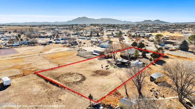 birds eye view of property with a mountain view