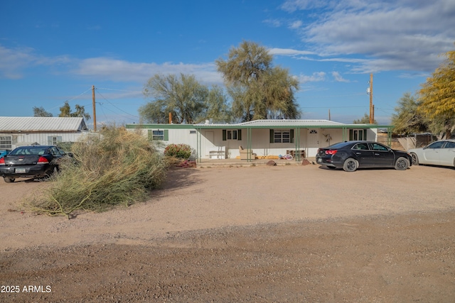 view of front facade featuring a carport and covered porch