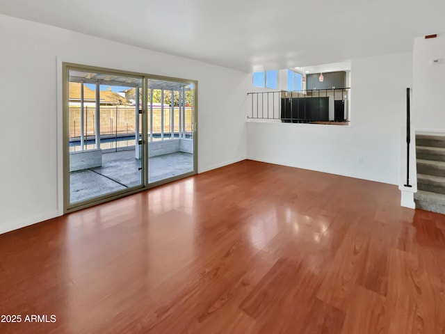 unfurnished living room featuring hardwood / wood-style floors