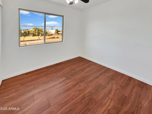 spare room with hardwood / wood-style flooring and ceiling fan