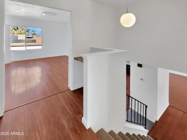 hallway with wood-type flooring