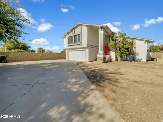 view of side of home with a garage