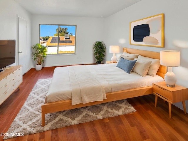 unfurnished bedroom with hardwood / wood-style floors