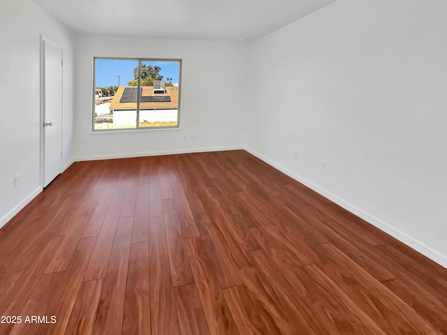 empty room featuring hardwood / wood-style flooring